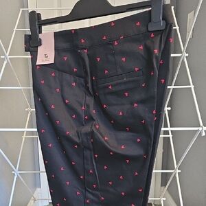 Womena Black Crop Pants with Red Heart Pattern.